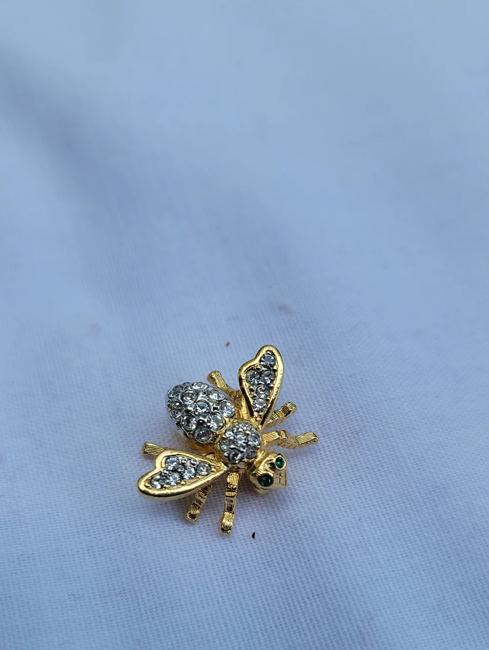 Vintage Joan Rivers Gold Tone Bee Brooch with Clear Crystals and Green Eyes